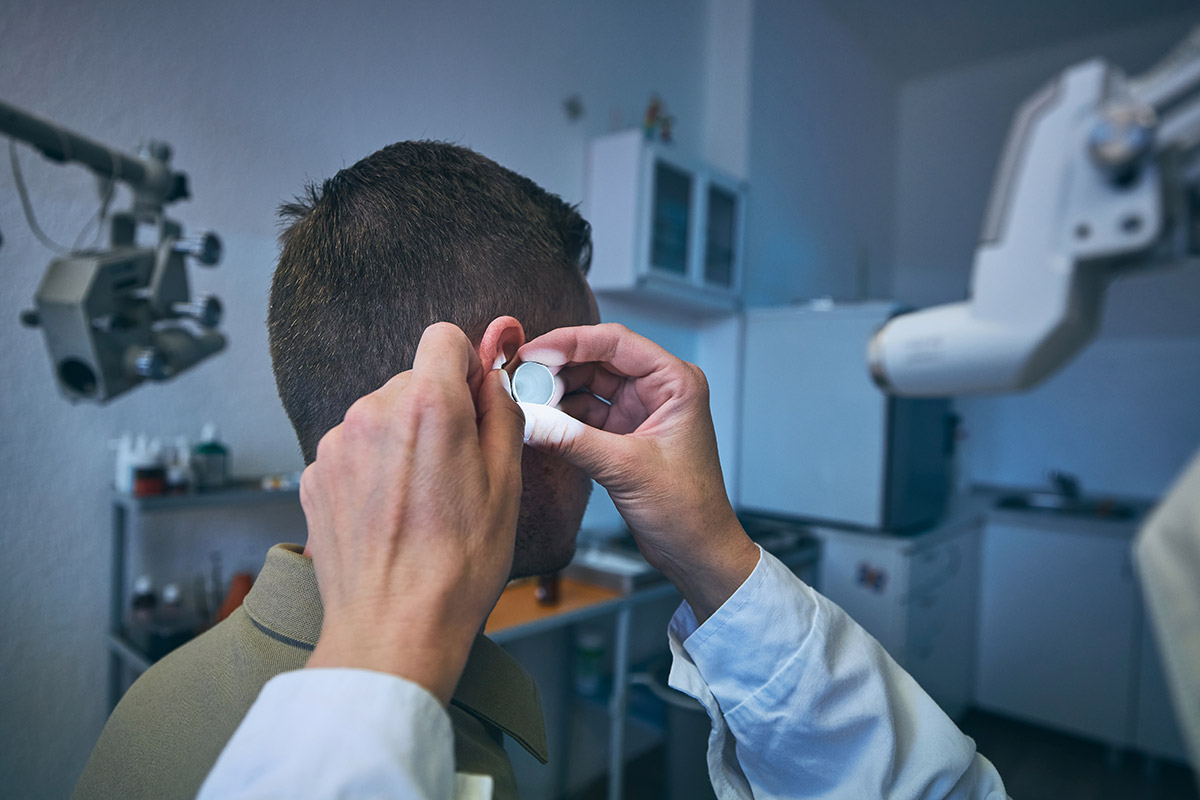 doctor doing ear examination young patient
